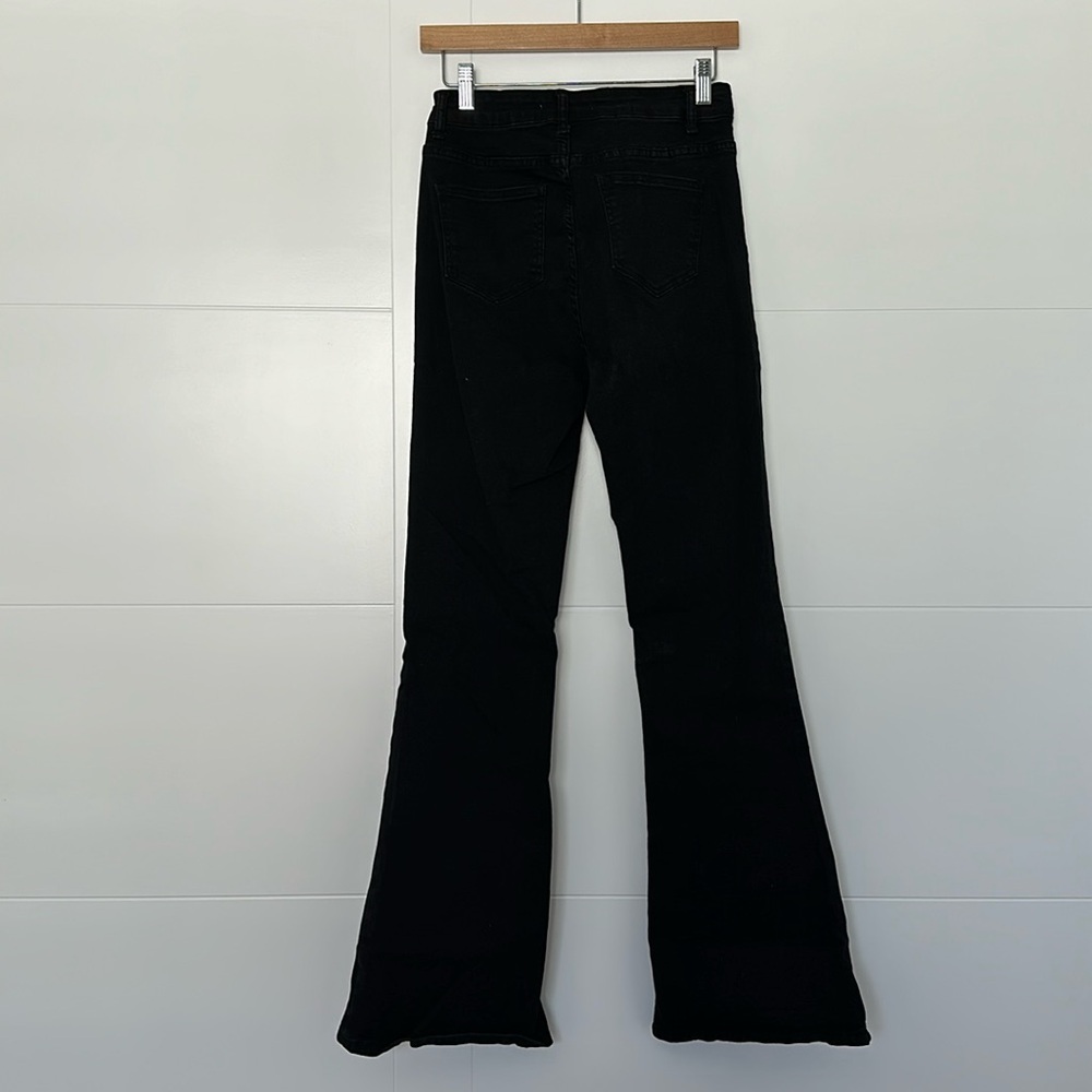 Black ultra stretch high rise stacked flare jeans, size 6